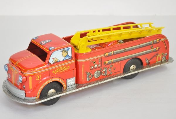 Marx Tin Fire Truck: 14" long, litho tin with friction motor. Plastic ladders are intact. It is clean & shiny, showing light playwear, C7-8