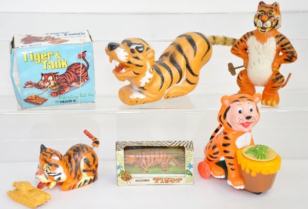 6 Interesting Tiger Toys: Boxed Marx Tiger & Tank, tail has crack, functional; 9" crouching Tiger, not marked, probably Marx; Whirl tail Tiger by Marx; Marx nodding tiger in box; English battery op tiger eating crab, untested,