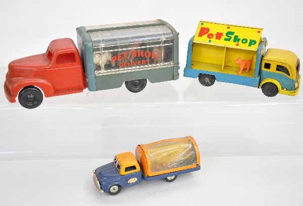 3 Vintage Pet Shop Vehicles: Includes a 10 1/2" Marx plastic Pet Shop delivery truck with 6 hounds; 6" Line Mar Pet shop truck with dog & cat, friction; 7" Pet shop truck with fold-up sides & 1 animal, missing 2 1/2 hub caps. Oth