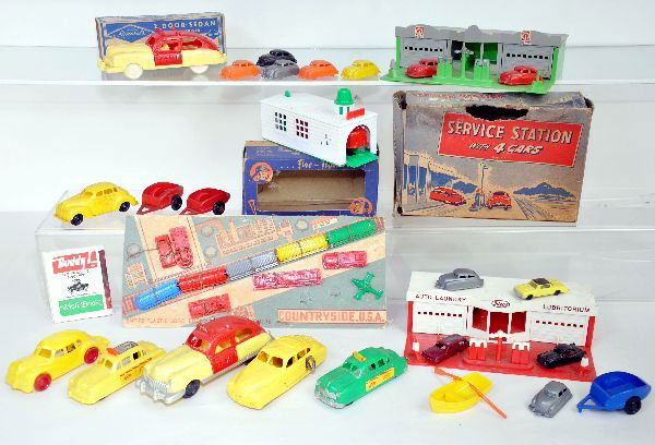 Nice Group Of Hard Plastic Vehicle Toys: Includes a boxed Elmar fire station with vehicle; Empire Countryside playset on worn card; 2 different Ideal service stations with vehicles, one has Ringo Service Station stickers, 1 worn box; 2 -6 1/