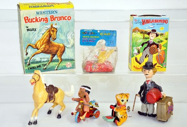 5Pc Toy Lot: Includes a boxed Marx Bucking Bronco, mechanism is functional; Boxed Roman Vagabond, 6 1/2" tall, plastic, mechanism is functional, needs a cleaning; Marx Tunette Car saxophone, sealed in packaging; M