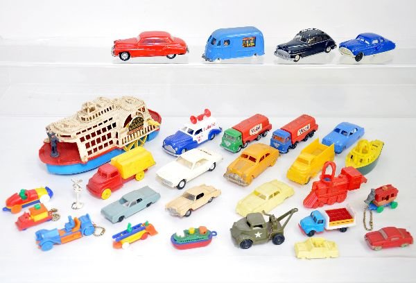 Large Group Of Hard Plastic Vehicles: Interesting assortment, highlights include a Marx take-a-part sedan & 8" riverboat; Red JYE sedan, mechanism functional; 6 keychain puzzles; Sound truck is modern, plus many others. Condition ranges C