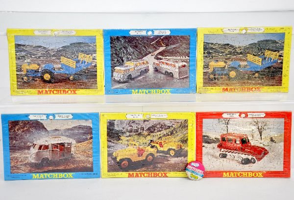 7Pc Unusual Matchbox Lot: Includes 6 different 1960s puzzles sealed, but dusty, C10; plus a Matchbox Collector pin back, C6