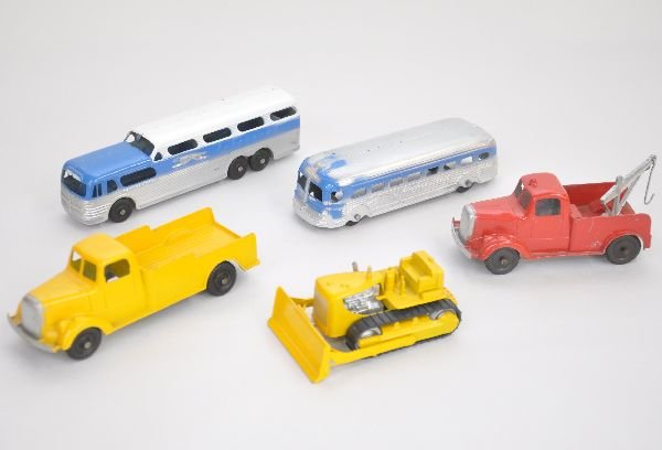 5 Nice Tootsietoy Jumbos: Includes Greyhound Scenic cruiser & 55 GMC busses; Mack step down stake truck; Mack L-Line tow truck; CAT Bulldozer. All are clean, showing light playwear, C7-8