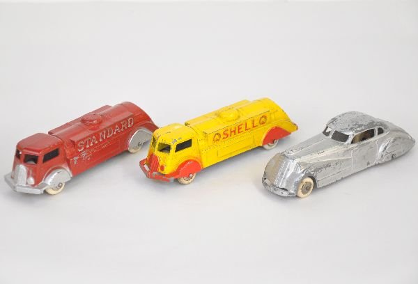 3 Prewar Tootsietoy Vehicles: All 6" models with white rubber tires. Includes Shell & Standard Fuel trucks, both show light to moderate playwear, C6-7; 1017 Silver coupe, C5