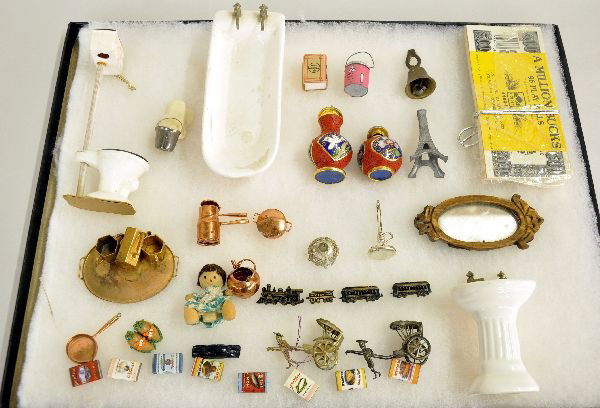 Group Of Miniatures: Includes a 3pc Porcelain doll house bathroom set with a 5" tub; 2 small oriental mini enameled jars; copper pots & pans; Doll house books; cloth doll; Play money; wood mirror and more. Various conditi