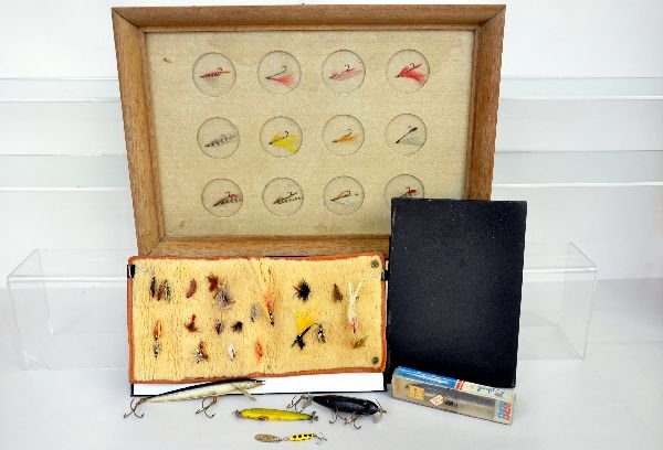Group Of Vintage Fishing Flies & Lures: Includes a 5" wood perch lure with glass eyes; 4 1/2" wood lure, painted eyes, no hooks; boxed 7" Rapala Lure, painted eyes; Boxed 6" Rebel Minnow sinker lure; leather roll with 23 assorted flies, som