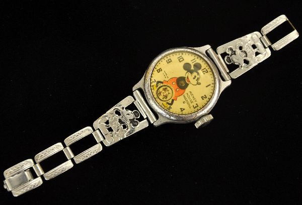 Rare 1933 Mickey Mouse Watch, TLC: Here is your chance to get the first one! Made by Ingersoll, this 1" face watch has an inset second hand dial with Mickey Mouse running in circles. It holds a wind, but stops shortly after shaking, ma