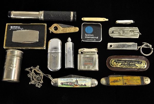 Lighters, Pocket Knives & Snippers, Plus: Includes 5 pocket knives, early example from east Cleveland Lumber Co with an image of a 1920s lumber truck, some rust; There are 2 cigar snippers, shaving stick can; pocket telescope; 3 lighters with
