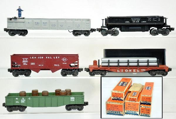 5 Clean Boxed Lionel Freight Cars: Includes 3562-25 barrel car, complete with packet & -78 box; 6462-25 gondola with barrels; 3469 coal dump with bin, no coal; 6511 pipe flat with cast bolsters; 6456 LV hopper. All are very clean with 