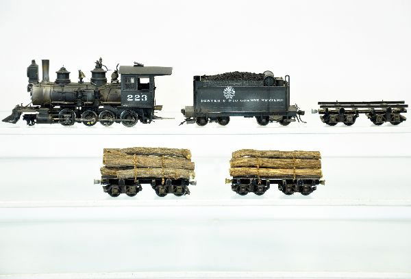HO Brass 4-8-0 Steam Logging Train: Lettered Denver & Rio Grande #223. It has been professionally painted & decaled with super detailing. It includes 2 flats with logs & one empty flat. The paint shows very light wear with light runtime