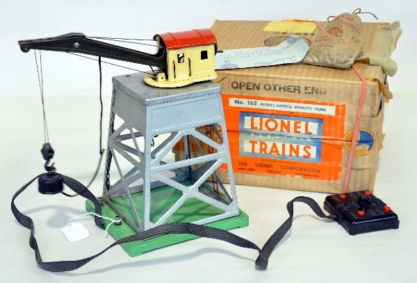 Boxed Lionel 165 Magnetic Crane: Clean with nice silver & controller. It has its scarce 165-83 bag of scrap and original box with insert, C7+