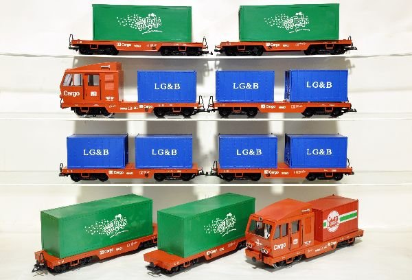9Pc LGB Cargo Container Train: Includes 2 #90960 powered diesels, 1 has 2 very small screw holes behind cab; 3 #90963 flats with containers; 3 #90962 flats with containers & a 90962 with incorrect container. All could use a light c