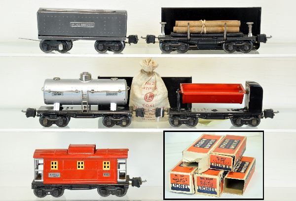 5 Boxed Lionel Prewar Freight Cars: Includes 2689W tender, gunmetal; 3659 coal dump car, complete, insert & packing ring; 3651 lumber dump with bin; restored 2654 tank car; 2657 caboose. All have 1939 couplers and worn obs. They show li