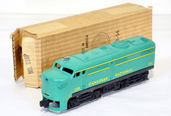 NMint Boxed Lionel 228 CN Alco Diesel: Nice unhandled patina with unrun chassis. It has some stains near frame from reaction to black oxide coating, but no playwear, with wrapping & C9 ob
