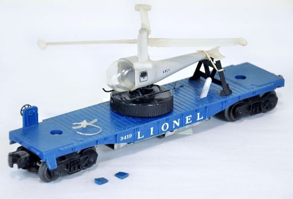 Rare Lionel 3419 Clear Blade Copter: This is the first production, dark teal flat with large winder. Navy copter with double clear blades & tail. Unfortunately, our consignor dropped it and broke the tail section & two steps off, still v