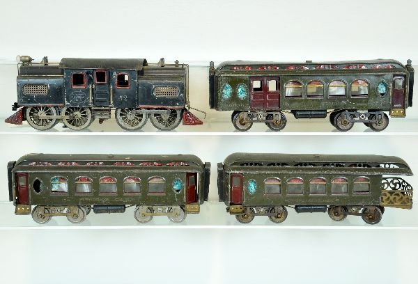 4 Pc. Lionel Manufacturing Set: ST Ga. 42 Electric loco, single motor with pedestal headlight; 19 combine, electrical posts added for lighting kit; 18 Pullman; 190 observation with long deck. Cars are embossed MFG. All show moderate
