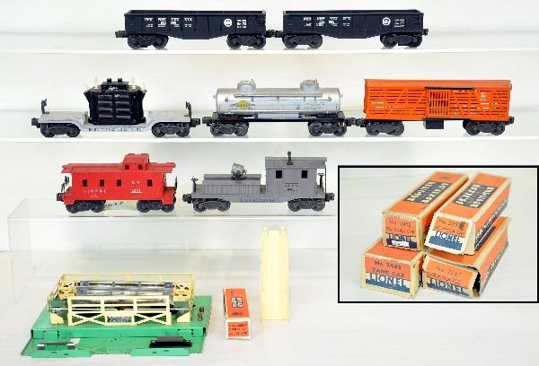 8 Lionel Freight Cars, 4 Boxed: Includes a 2420 searchlight work caboose, some edge wear on tool boxes; 2465 tank car, ob; 2 #2452 gondolas 1 ob; 2257 caboose, worn ob; 3656 stock yard with -34 boxed cows; 6461 transformer car. All