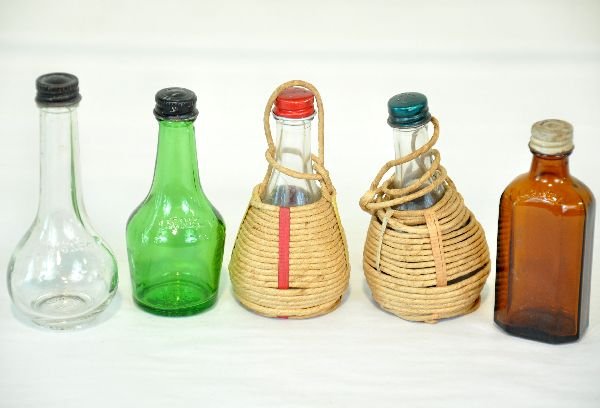 Unusual Lionel Bottles: For the Lionel collector who has everything. Here are 5 original Lionel non-train items that they made in the postwar era. Includes a pair of wrapped salt & pepper shakers; green glass bottle; amber g