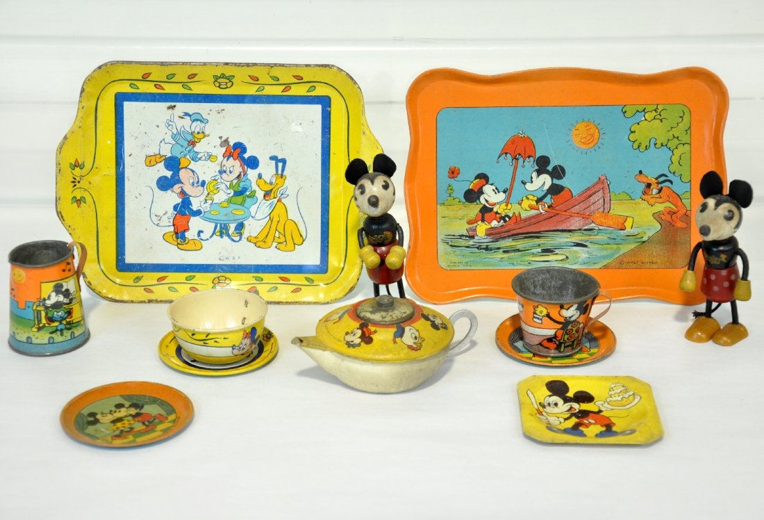 Early Disney Mickey Mouse Toys: Circa 1930s. Includes a pair of 4" Nifty wood Mickey & Minnie figures. They are clean & intact with 80% decals, C7+. There are also several pieces of litho tin tea set items, all with great graphics,
