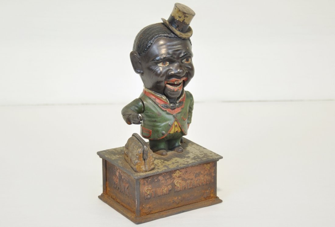 Shepard Hardware Stump Speaker Mechanical Bank: Dated 1886. Nice original figure paint with 20% paint on base with light rust. The mechanism is functional and has a great look, C4