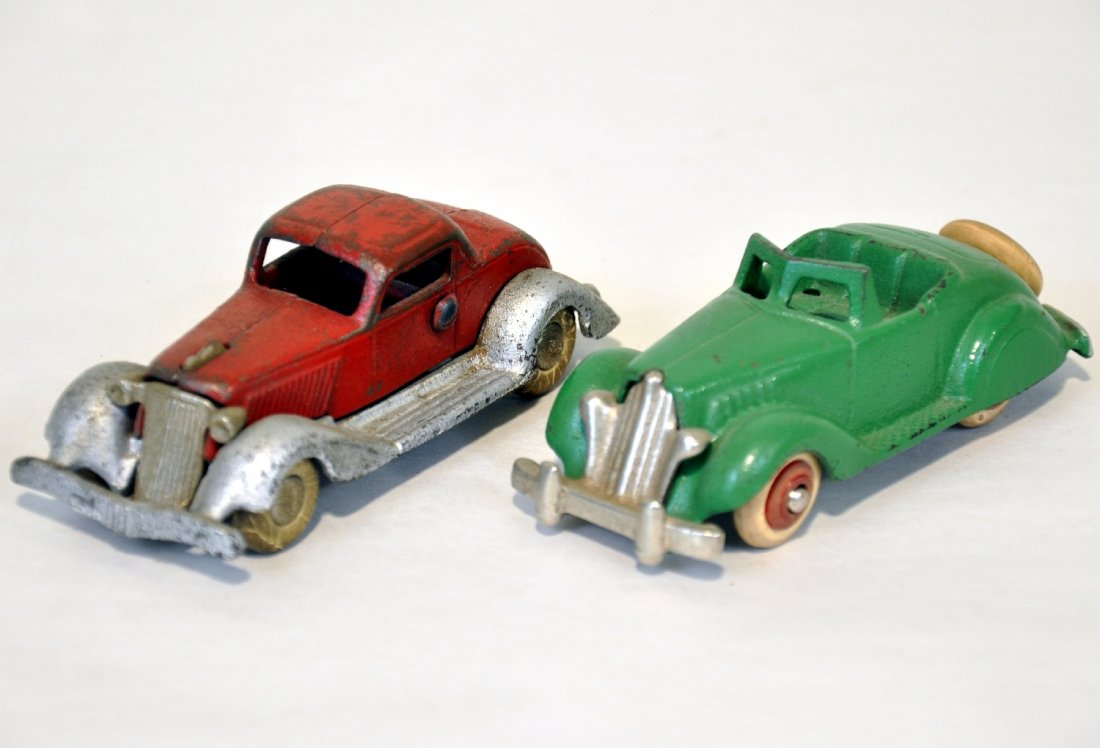 2 Cast Iron Vehicles: Painted cast iron with nickel grilles & hubbed wheels. Includes a 4" Hubley roadster with great paint, C7+; Arcade take-apart coupe, showing moderate playwear, C5