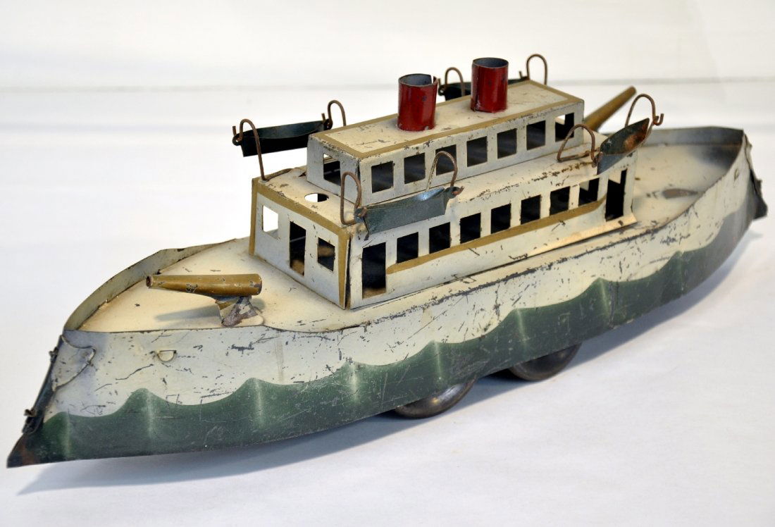 Nice Dayton Friction Gun Boat: Hand painted pressed tin with friction motor, 19" long. Has its original life boats & 2 guns are still intact. It shows moderate playwear, C5-6