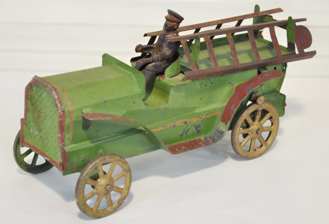 Nice Dayton Friction Fire Ladder Truck: Hand painted pressed steel with cast iron driver & friction motor. It has its original ladders and has much nicer paint than usually found, C5