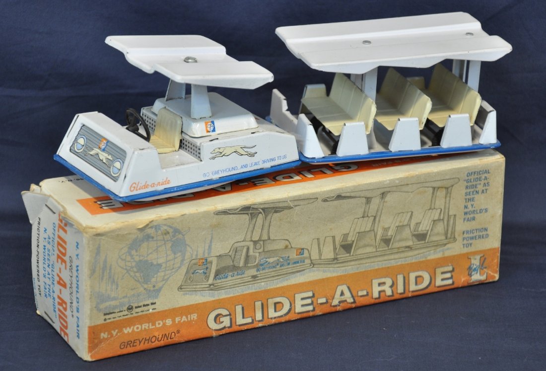 Boxed New York Wolds Fair Glide-A-Ride: Circa 1963. Lowell Toy Mfg, litho tin friction 9" long, Greyhound bus from the 1963-4 NY Worlds Fair. It is clean, showing light playwear with a nice original box, C8