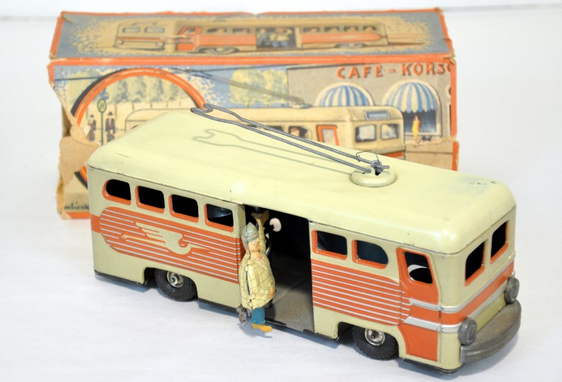 Scarce Boxed Gunthermann Electric Bus: Germany. Litho tin, 9" long. Mechanism functions with bell, stop-& go action with animated passenger. It is clean & shiny, showing light playwear with an incomplete original box, C7+