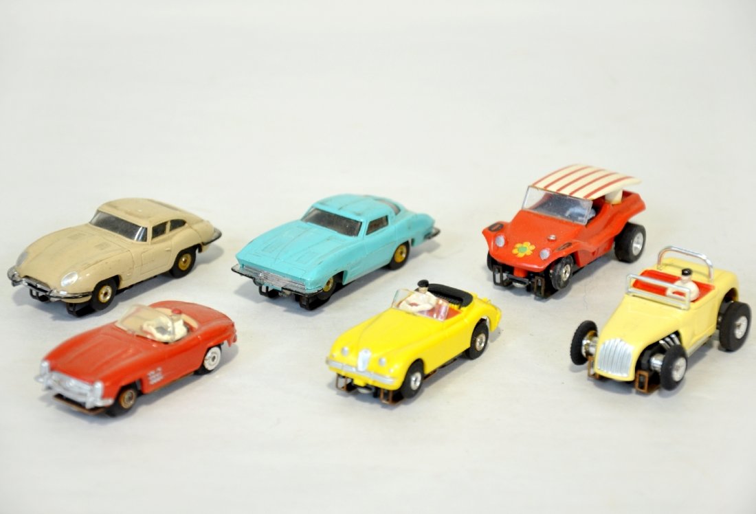 6 Aurora HO Slot Cars: Includes an early Corvette convertible with vibe chassis; Early Jaguar convertible on T-Jet chassis; Dune Buggy; Jaguar, chrome worn, C5; Hot Rod & split window Corvette. Otherwise all show light to m