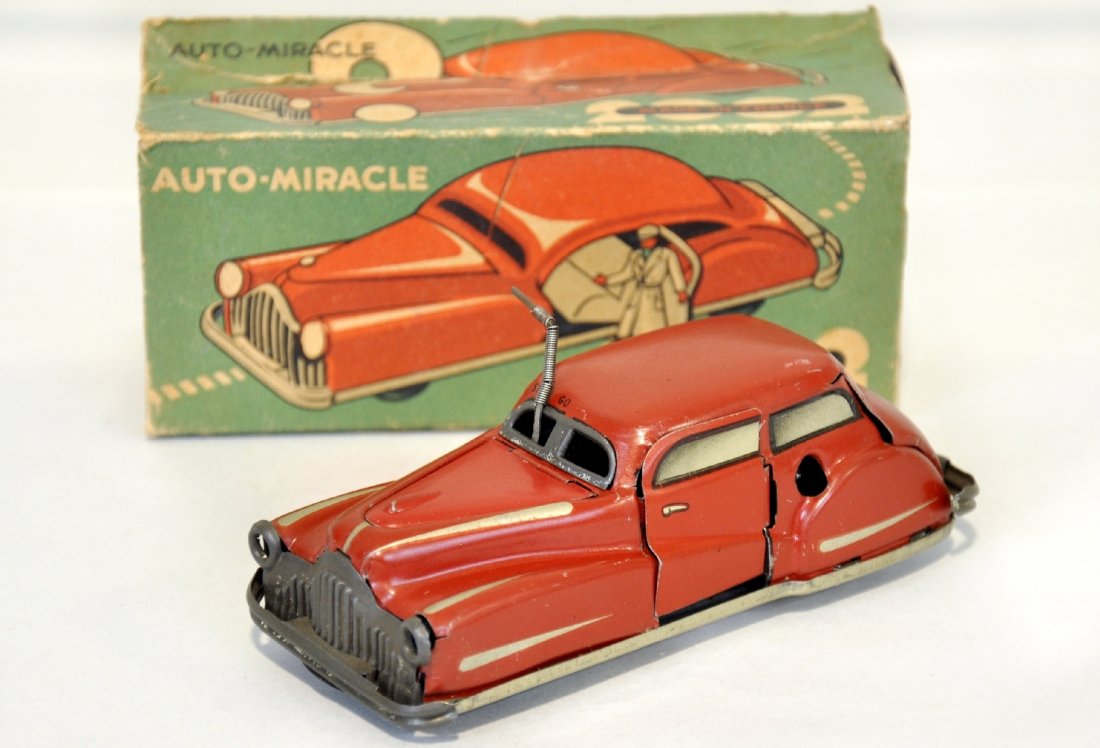 Super Action Joustra Toy Automobile: France. Litho tin, 5". Great action with functional mechanism, it rolls in an oval pattern, opens its hood, opens the driver door with driver, stops & starts and more! Is shows light wear to chrome wi