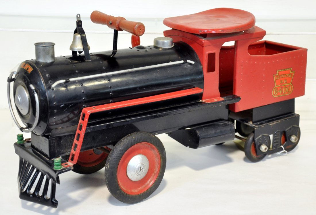 Nice Keystone 6400 Ride-On Train: Painted pressed steel, 26" long with rubber wheels & wood steering bar. It is fairly clean & nice & shiny with 95% decals. It shows light playwear, missing whistle bellows, C7-7+
