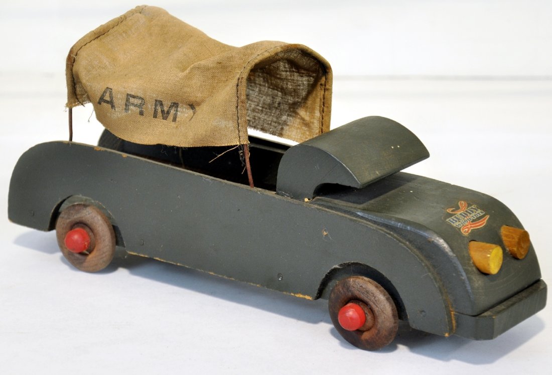 Unusual Buddy L Army Truck: Nice war production piece, 12 1/2" painted & decaled wood with its original canvas cover. It shows light playwear, C7-7+