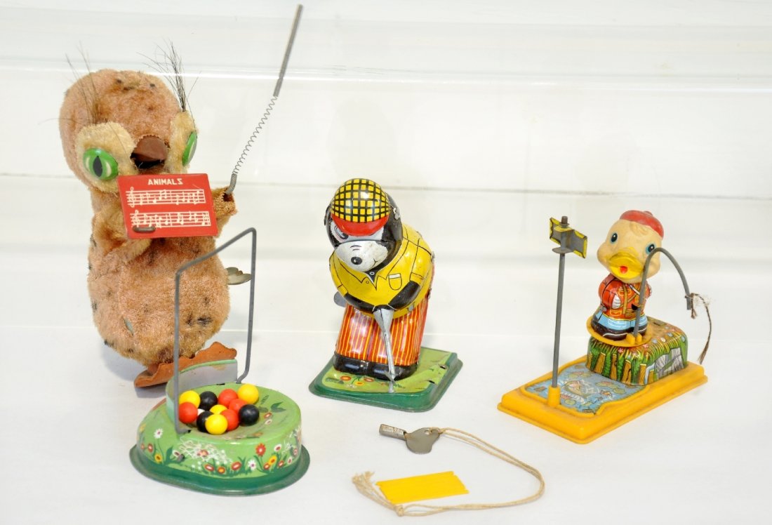 3 Japanese Wind-up Toys: Includes a TPS Golfing Bear with 14 balls, hole piece with plastic ramp missing nibs, functioning; Yone fishing duck, missing fish; 6" music directing Owl, functioning, but rubber feet are misshapen.