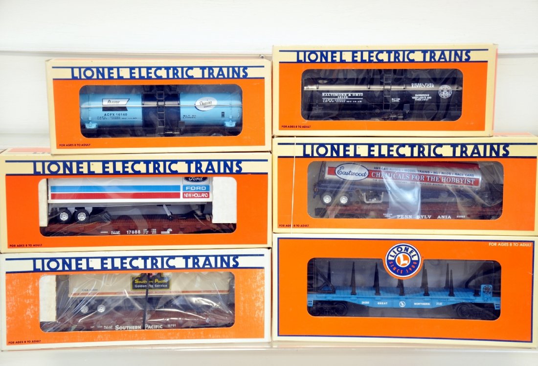 6 Mint Lionel Freight Cars: Includes 26066 GN bulkhead flat; 17888 Conrail trailer flat; 16136 B&O tank; 17889 SP trailer flat; 16140 Domino tank car; 52083 PRR flat with tank trailer. All appear unrun with boxes, C9-10