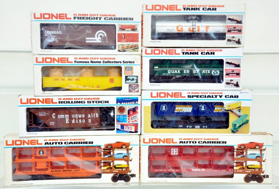 8 Assorted Lionel MPC Freight Cars: Think Stocking Stuffers for the holiday! Includes 6301 tank car; 9281 auto-carrier; 9145 auto carrier; 9037 boxcar; 6302 tank; 9283 gondola; 6531 flat with vans; 6112 hopper. All show light runtime wi