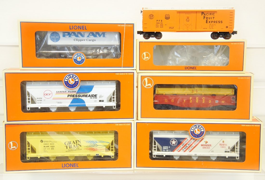 6 Mint Lionel Freight Cars: Includes 17314 PFE reefer; 52341 LI flat with trailer; 17156 Pressureaide 3-bay hopper; 17139 grain train hopper; 36085 FEC coil gondola; 17157 Wonder Bread hopper. All appear unrun with boxes, C10