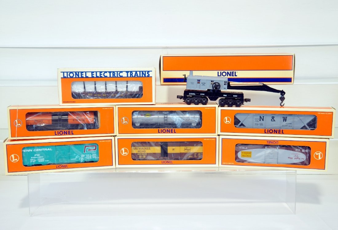 8 Lionel Freight Cars: Includes 16150 tank car; 17224 boxcar; 17225 boxcar; 18373 stake flat; 19329 hopper; 17226 boxcar; 19611 tank car; 19634 6-wheel crane. All show light runtime with C9 bodies & boxes