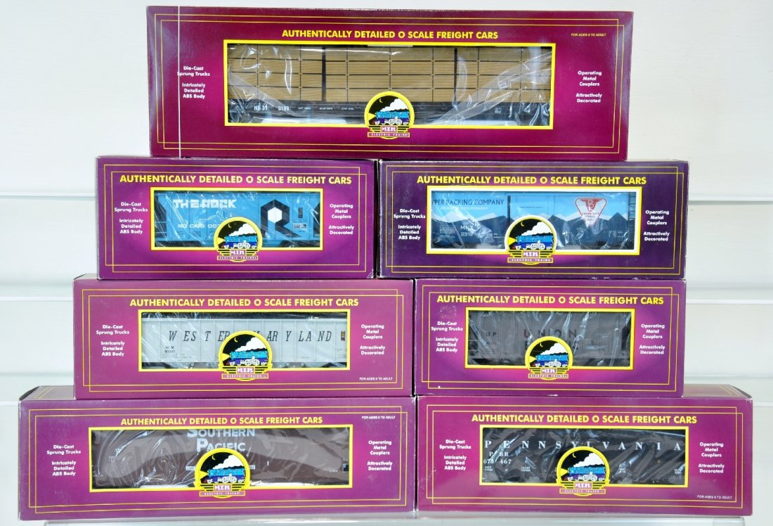 7 MTH Premier Freight Cars: Includes 20-98255 I-beam lumber flat; 20-97504 wood chip hopper; 9400L reefer; 20-97103; Hoppers- 20-97010L; 97103; 97402; 90003d. All show light runtime with C9 bodies & boxes