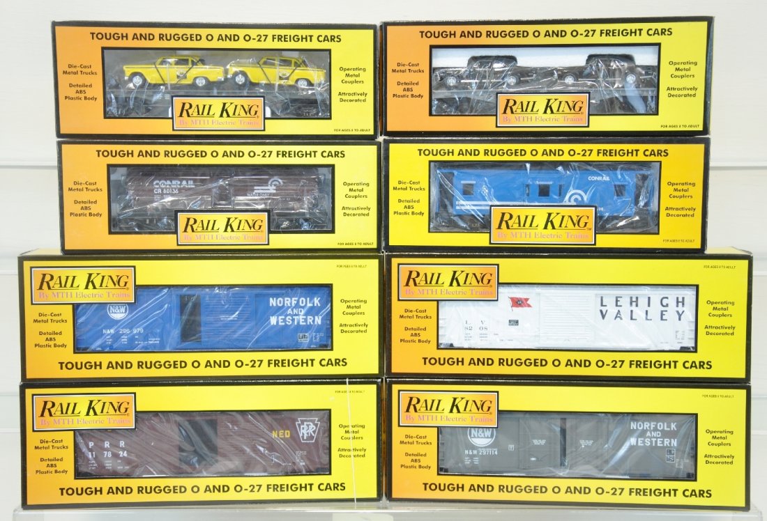 8 MTH RailKing Freight Cars: Includes 30-7321 tank car; 30-7717 caboose; 30-7661 & 7625 auto transporters; 30-7448 boxcar; 30-7470 boxcar; 30-7476 boxcar; 30-7442 boxcar. All show light runtime with C9 bodies & boxes