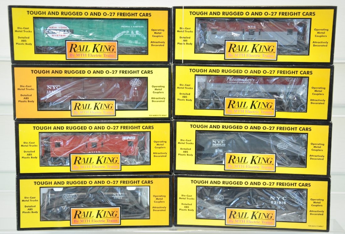 8 MTH RailKing Freight Cars: Includes 30-7310 tank car; 30-7517 hopper; 30-7711 caboose; 30-7513 hopper; 30-7608 trailer flat; 30-7440 boxcar; 30-7414 boxcar; 30-7712 caboose. All show light runtime with C9 bodies & boxes