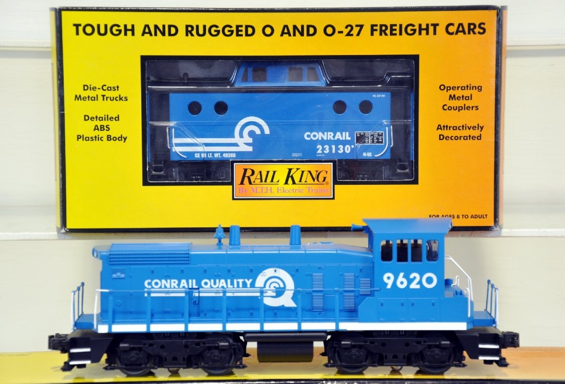 MTH RailKing Conrail Diesel and Caboose: SW-1500 Engine w/ Loco-Sound No. 30-2216-0 comes equipped with headlight and backup light, 2 flywheel equipped motors and operates on O-27 track. Also included is N5c Caboose 30-77097. Both units have