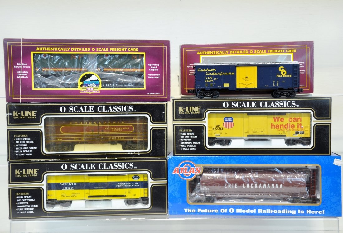 6 Pc MTH K-Line Atlas Freight Car Lot: Includes MTH Northern Pacific Flat Car 20-98105, Chesapeake and Ohio Reefer 20-94011, K-Line NYC Reefer K761-1751, PRR Reefer K7604, UP Boxcar K765-2111, Atlas ACF Hopper #6303-1. Some Cars are unrun.