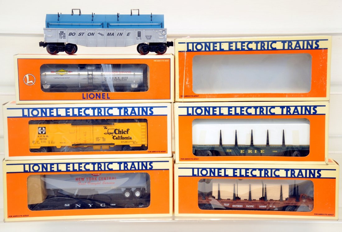 6 Lionel Freight Cars: Includes 16386 SP flat car with load, 52016 NETCA B&M coil car, 16932 Erie rail car, 19608 Sunoco tank car, 52135 AT&SF reefer, 16925 NYC trailer flat, all show light runtime with C9 bodies with boxes