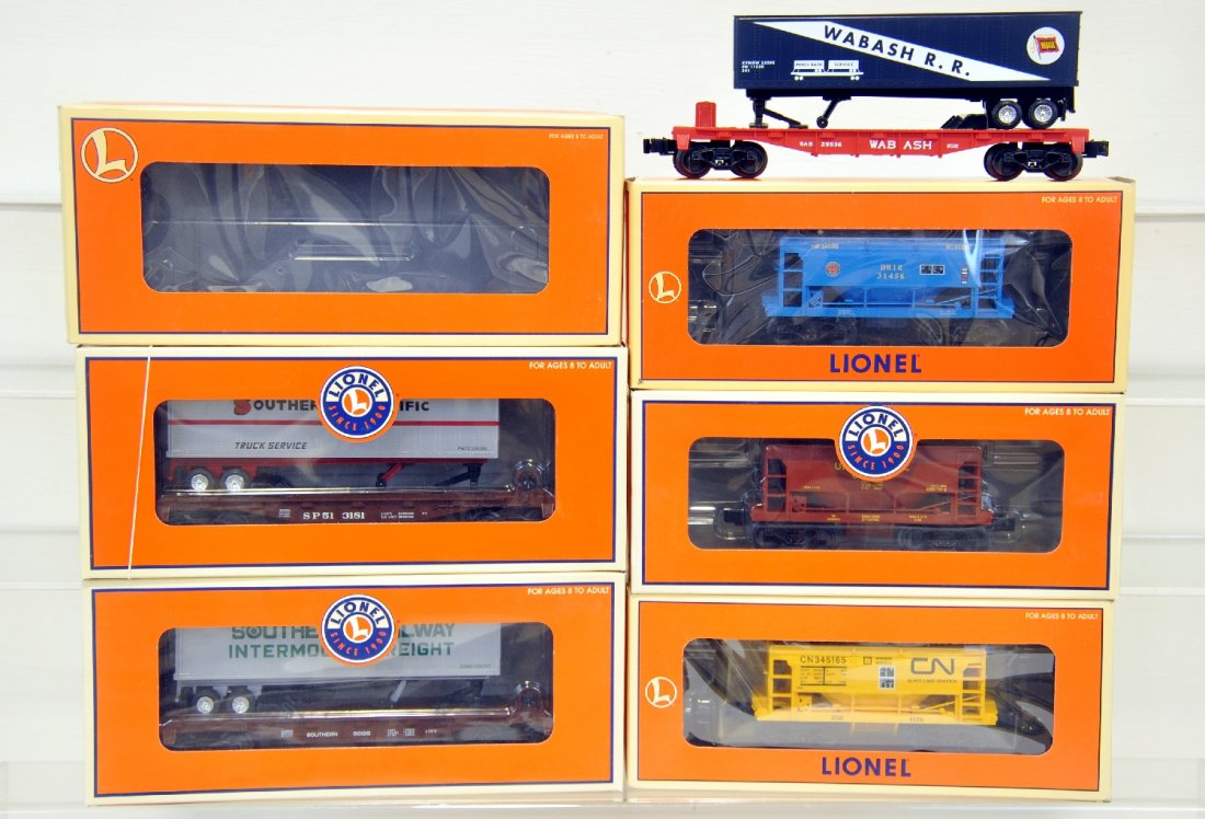 6 Lionel Freight Cars: Includes Flat cars with trailer- 36086 SP, 36065 Wabash, 26006 southern; Ore Cars- 17803 DM&IR, 17801 CN, 17804 UP. All appear like new with boxes, C9-10
