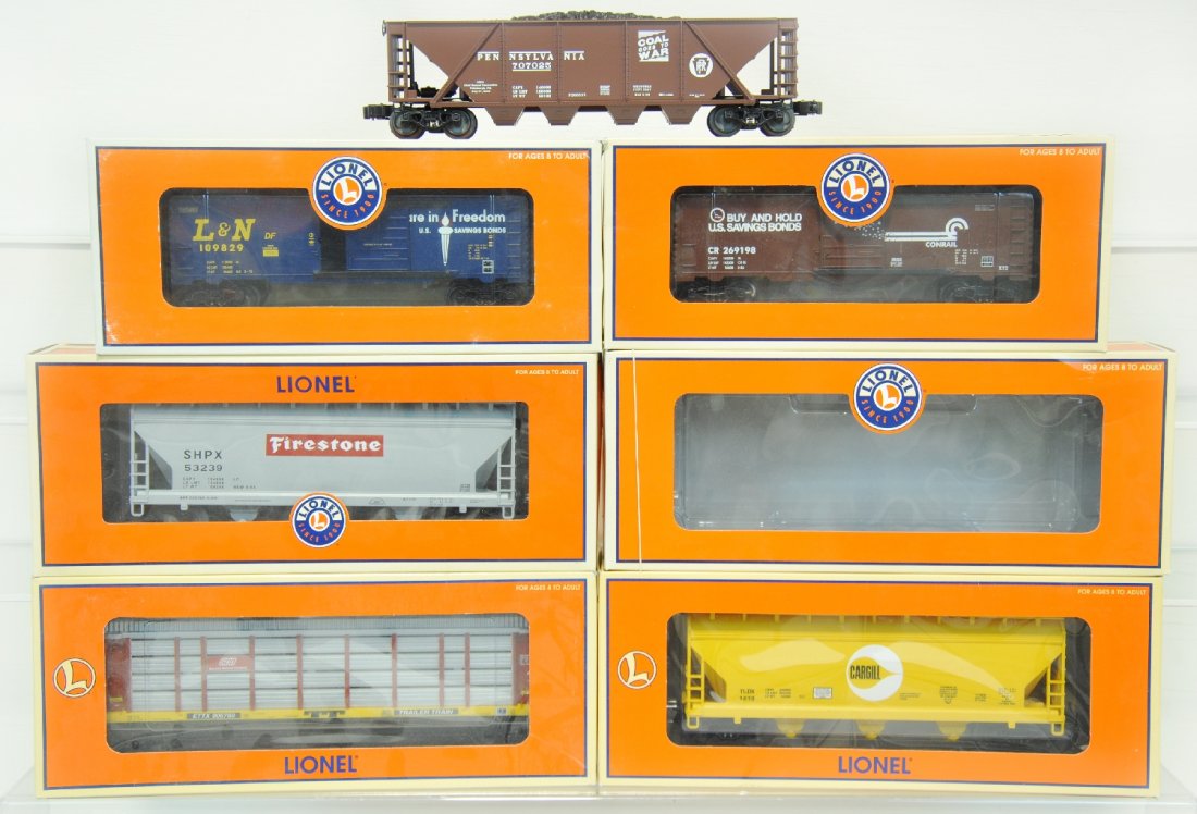 6 Lionel Freight Cars: Includes 39222 Conrail boxcar, 52267 PRR quad hopper, 39093 SOO auto-carrier, 39221 L&N boxcar, 17137 Cargil AFC hopper, 27119 Firestone 3-bay hopper. Some show light runtime, all have C9 bodies with