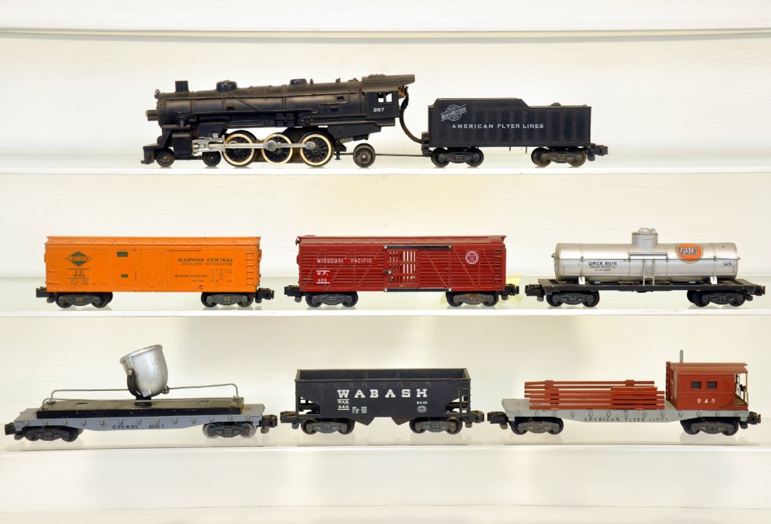 7Pc American Flyer 287 Steam Freight Set: S Gauge. Includes a 287 C&NW Pacific loco & tender; 923 IC reefer; 925 Gulf tank car; 929 MP stock car; 934 searchlight car, C6; 940 Wabash hopper; 945 work caboose. They are otherwise clean and show 