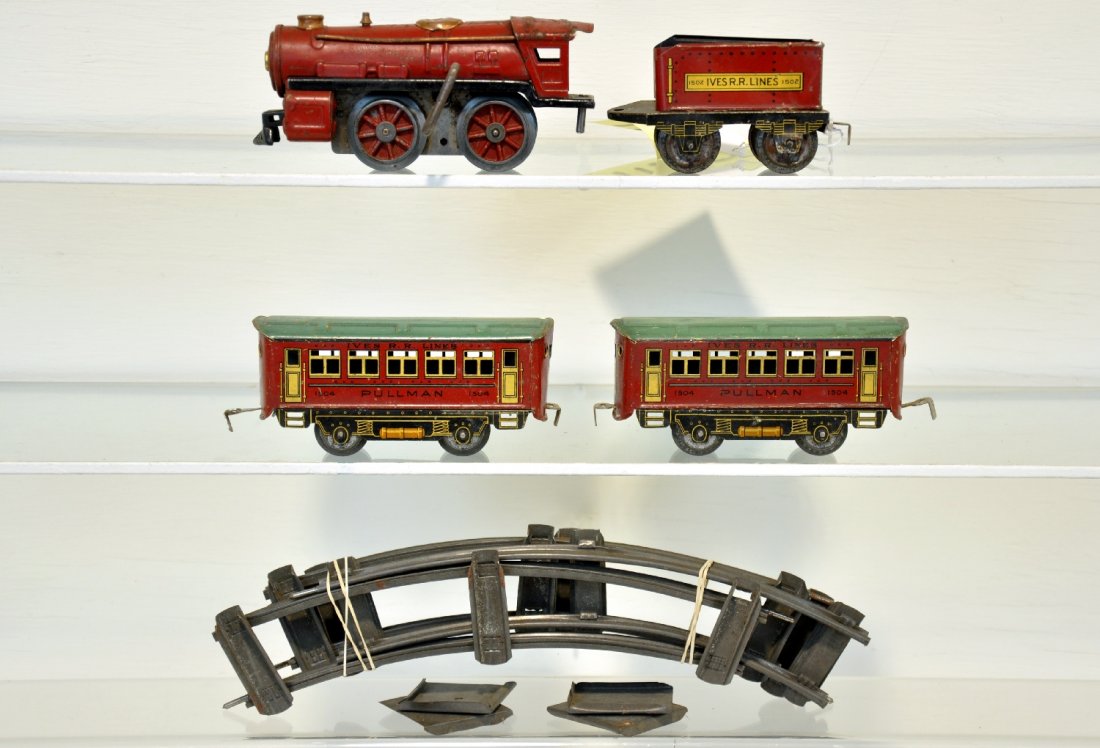 Ives Train Set: Includes a 1501 steam loco, mechanism functional with key; 1502 tanker; 2 #1504 Pullmans. Comes with 4 curve tracks & clips. They show moderate playwear, C5+