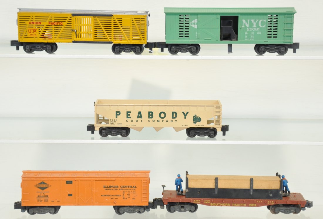 5 American Flyer 5-Digit Freight Cars: S Gauge. Includes 24076 UP stock car, pike master trucks; 25016 "Mo & Joe" lumber unloader; 24230 Peabody hopper; 24403 IC reefer. All are clean, showing light to moderate playwear, C7